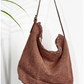 A mocha coloured shouder bag ethically handcrafted from sustainabe jute, designed in Australia.