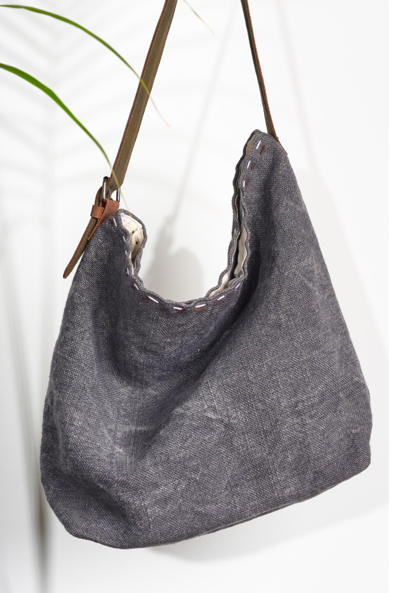 A charcoal grey shouder bag ethically handcrafted from sustainabe jute, designed in Australia.