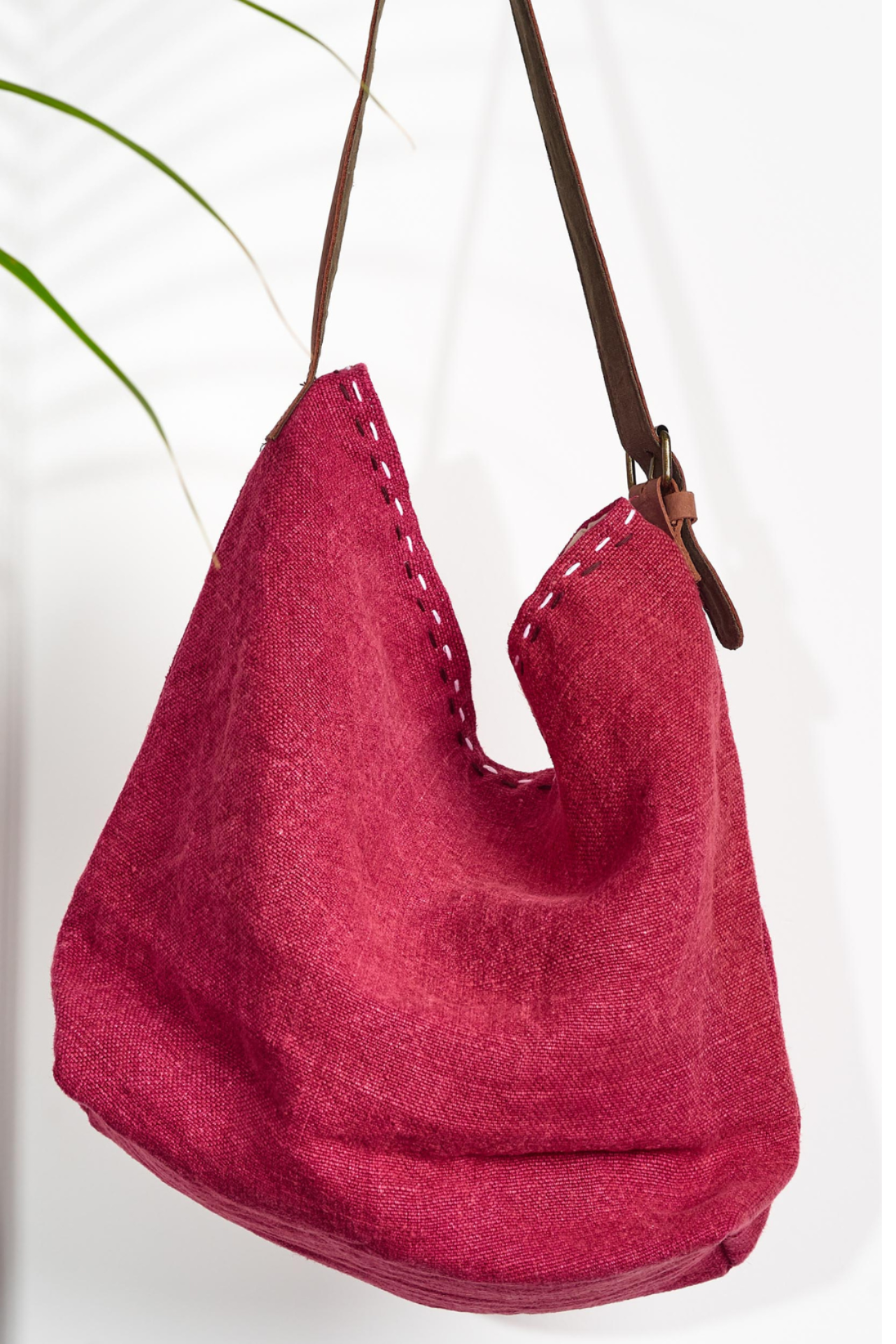 A red shouder bag ethically handcrafted from sustainabe jute, designed in Australia.