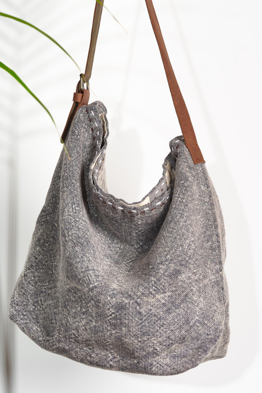 A light smoke gray  shouder bag ethically handcrafted from sustainabe jute, designed in Australia.