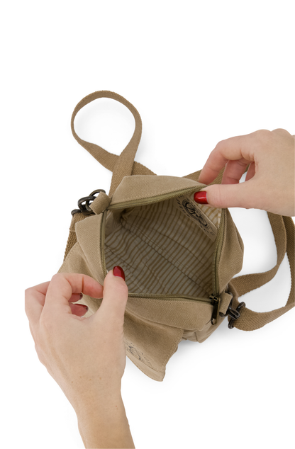 Hard wearing canvas mini crossbody bag with fully adjustable/removable  strap showing interior view of coordinating coloured striped cotton lining