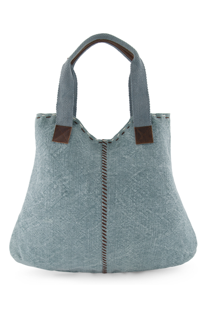 The front view of Chambray coloured ethically sourced jute tote bag shows hand sewn highlight stitching down centre front and across the top edge. Soft woven cotton shoulder straps, reinforced with leather hand grips and soft leather trim where straps are joined to the tote.