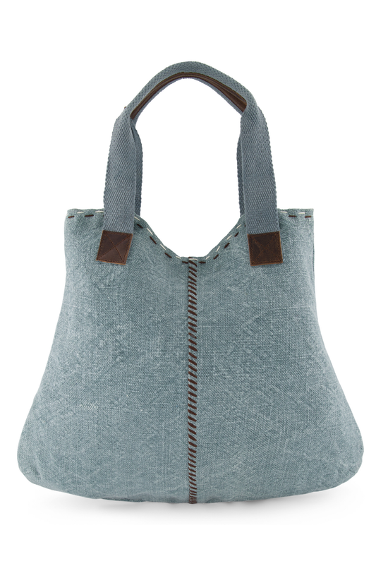 The front view of Chambray coloured ethically sourced jute tote bag shows hand sewn highlight stitching down centre front and across the top edge. Soft woven cotton shoulder straps, reinforced with leather hand grips and soft leather trim where straps are joined to the tote.