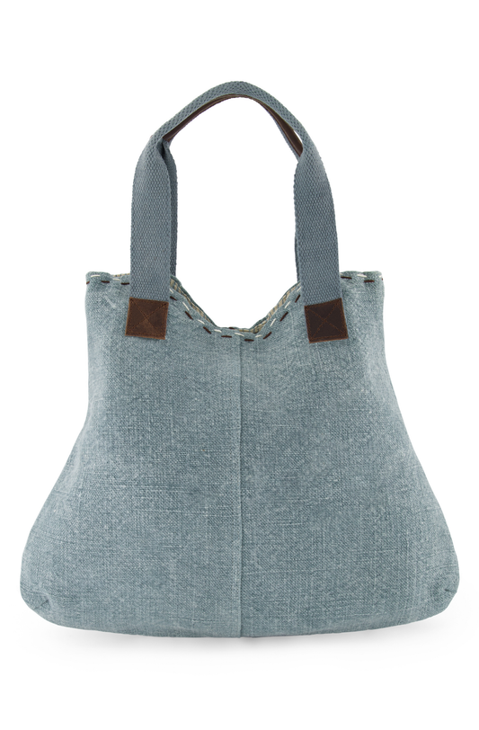 Chambray coloured ethically sourced jute tote bag, with soft woven cotton shoulder straps, reinforced with leather hand grips and soft leather trim where straps are joined to the tote.