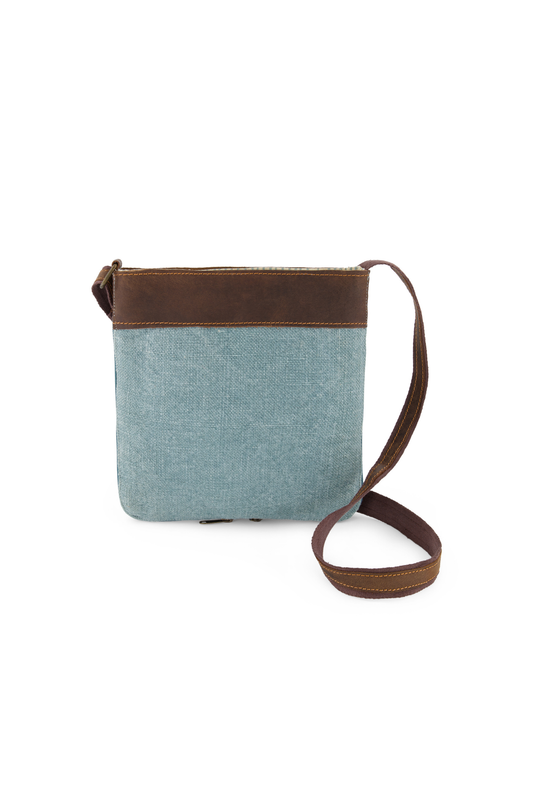 Chambray, light blue mini crossbody bag made from sustainable jute and soft leather, with adjustable crossbody strap