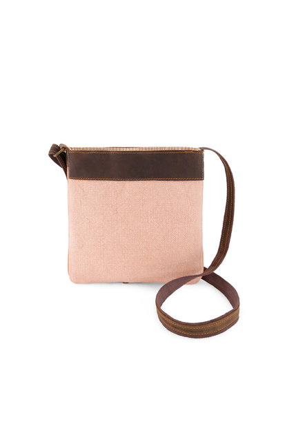 Peony pink coloured mini crossbody bag made from eco friendly jute with soft finished leather strap and trim