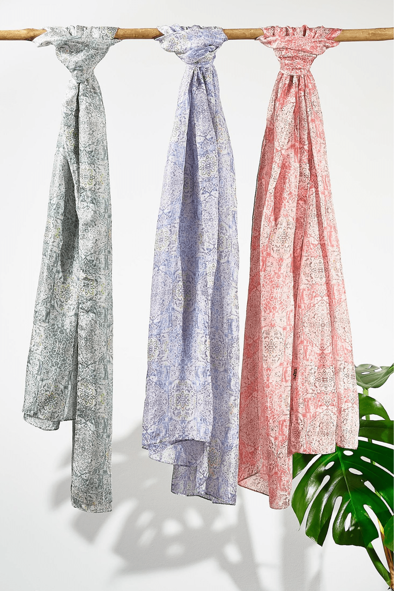 All three swatches of the scarves next to each other showing the colour difference