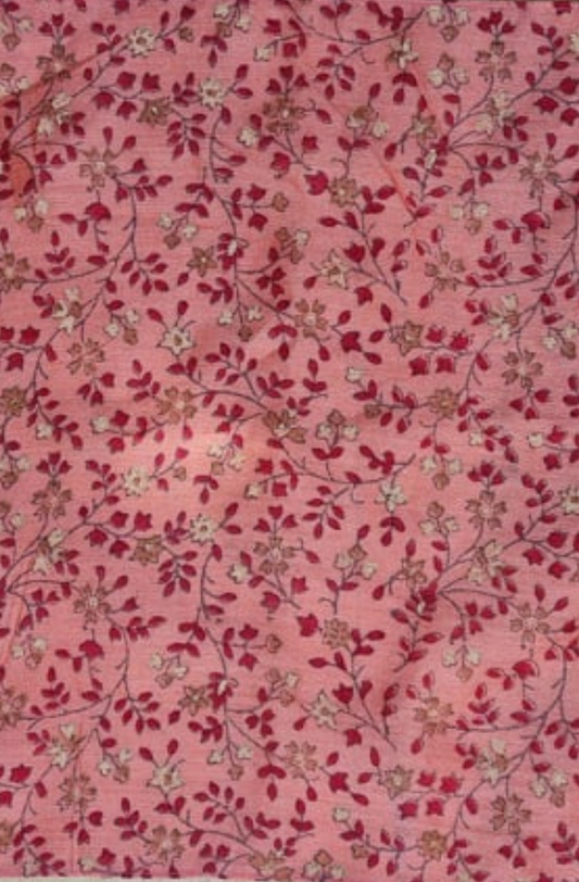 a close up of a pink, red and white floral patterned silk pocket square