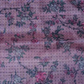 A dusty light pink with a vine type floral pattern sparsely covering the square